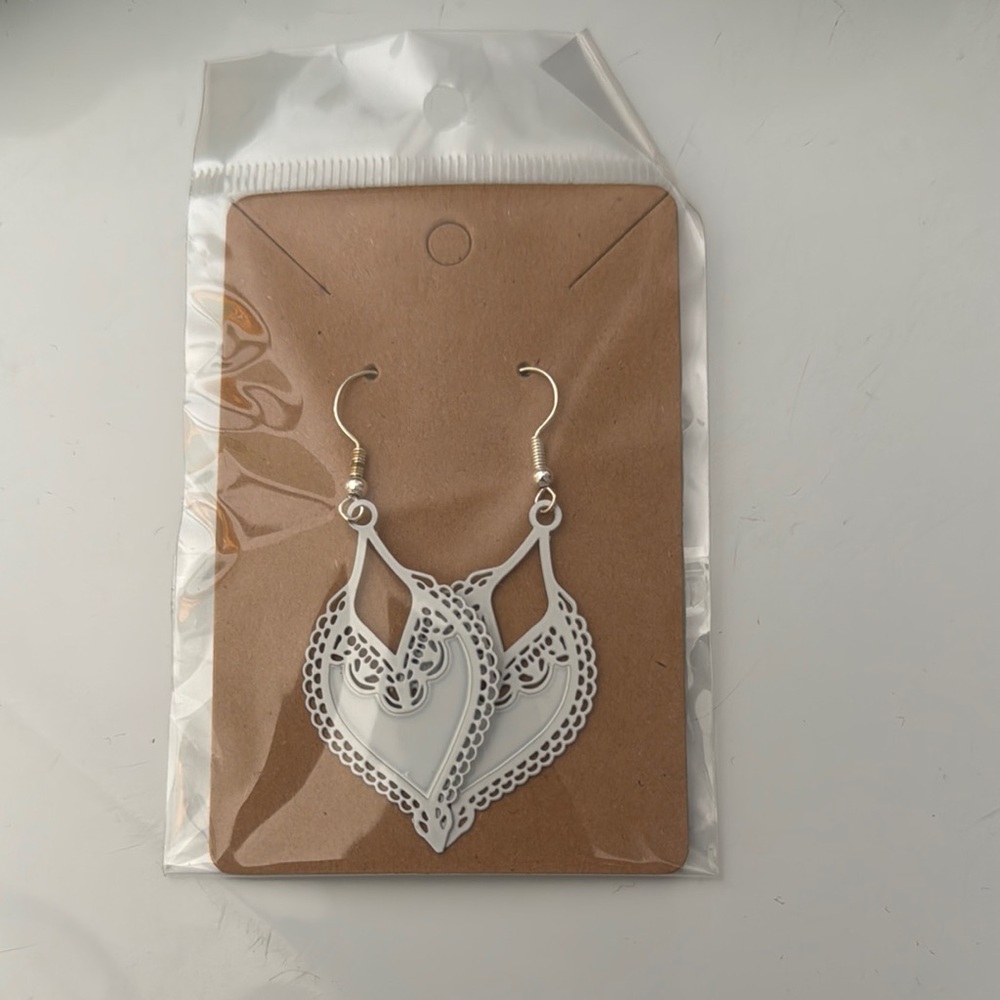 Elegant White Earrings with Intricate Dangle Design